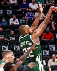  巴特勒三双热火加时险胜尼克斯  